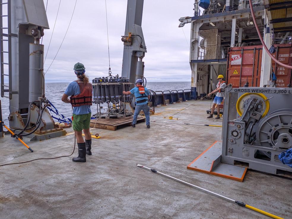 Noah Schuhmann(left) and Ralph Till (right) manage the taglines—which help provide stability for the GloFlo bottles as they are deployed to collect water and take measurements of temperature, salinity, and depth of the water. Photo courtesy of Claire Till.