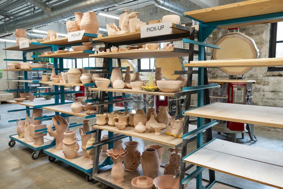 Rows of student work line the shelves in Jenkins Hall.