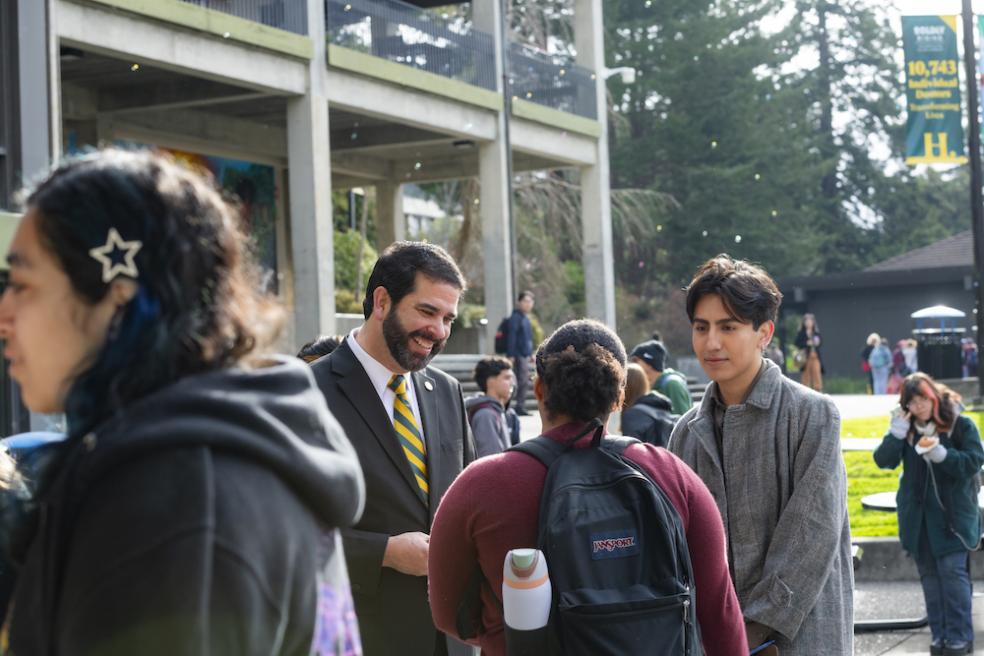 President Carvajal in quad talking with students