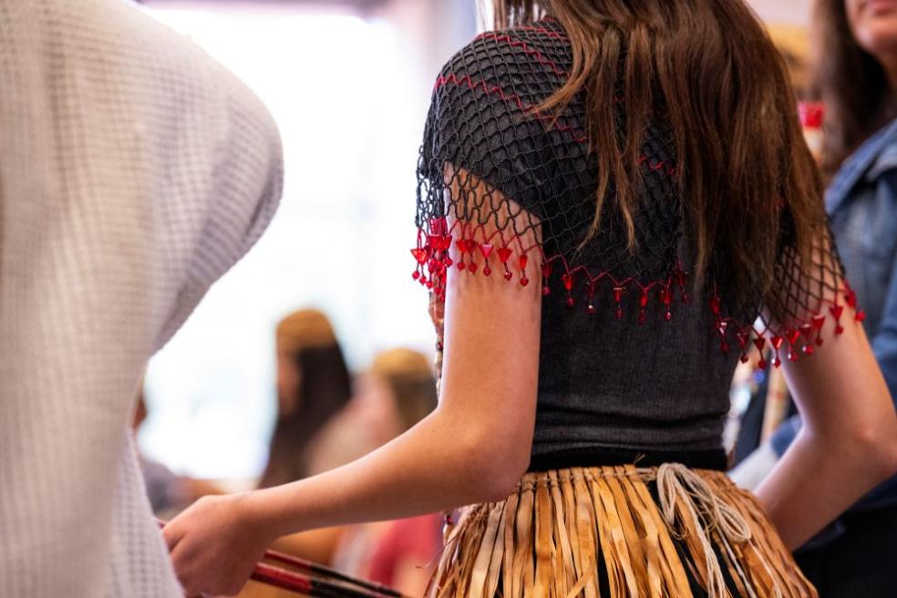 A photo of a the back of a dancer at during a Big Time event. 