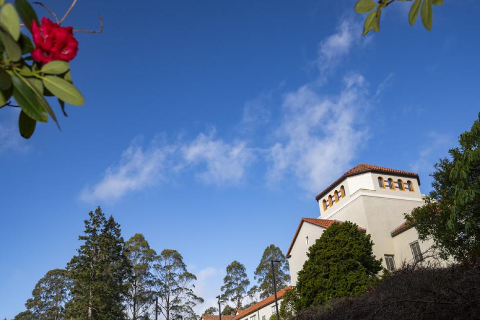 A photo of Founders Hall and a blue sky. 