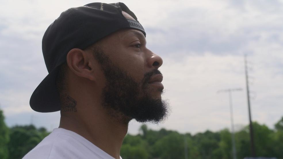 a profile of a man staring off into the distance