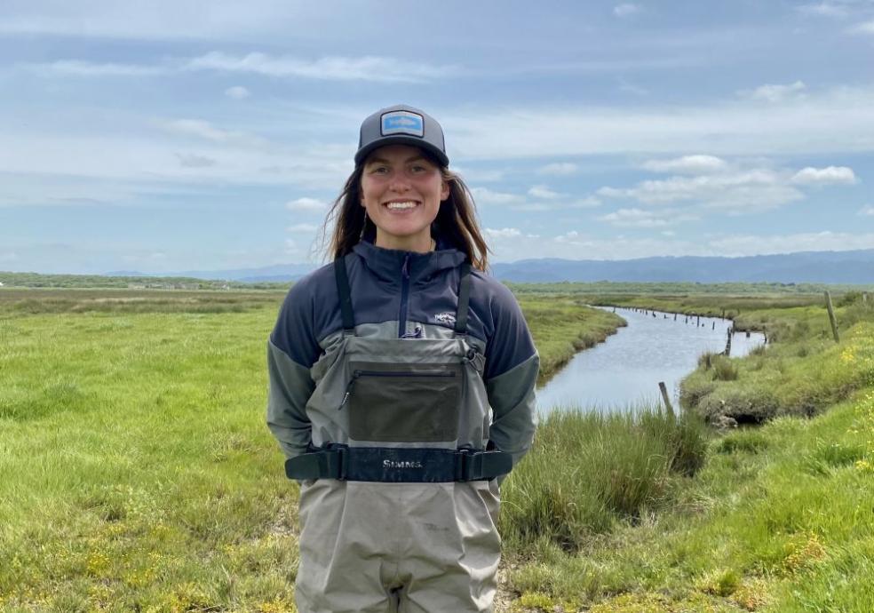 A photo of Farrah Tyler at Cannibal Island, which is a site in the Eel River Estuary that will undergo tidal marsh habitat restoration in 2027.