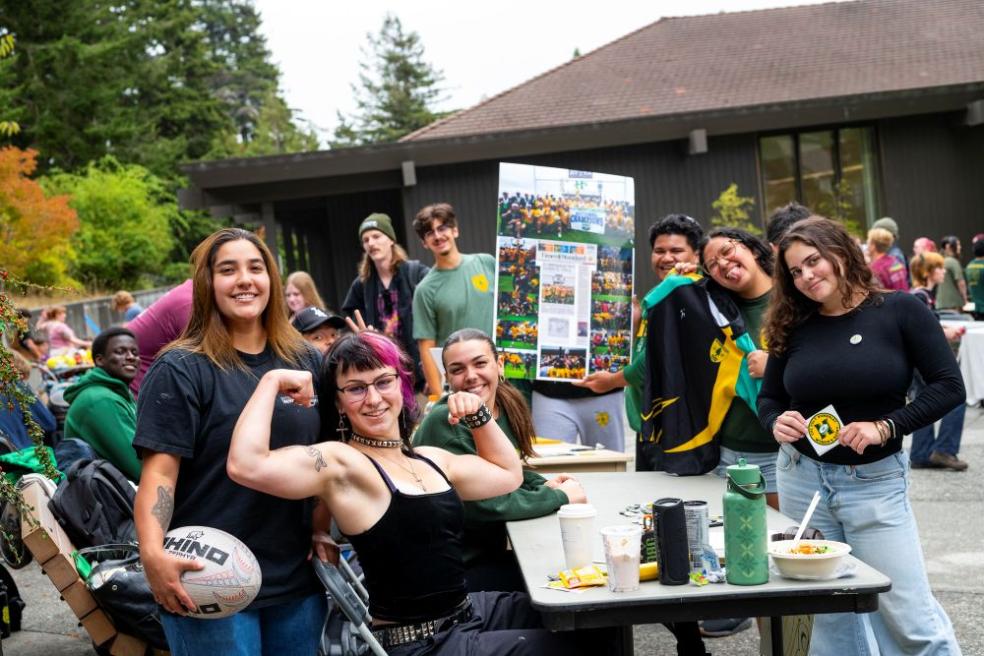 A photo of the Cal Poly Humboldt Women's Rugby team tabling during a club fair.