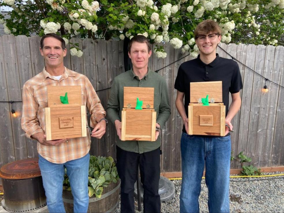 A photo of 2026 Sustainability Champion Awards (left to right): Justus Ortega (on behalf of Jennifer Ortega), Christopher Dubois, and Riley McDaniel