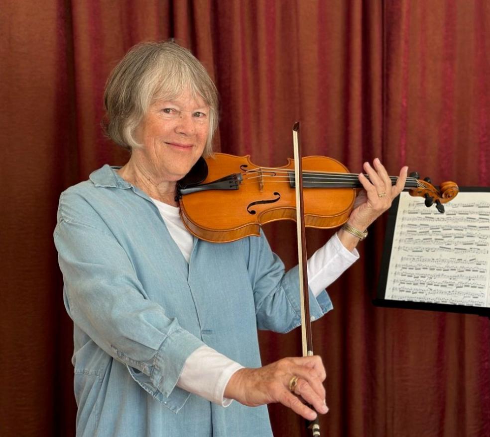 A photo of Julie Fulkerson with a violin
