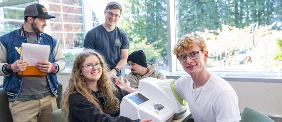 students taking a fellow student's blood pressure