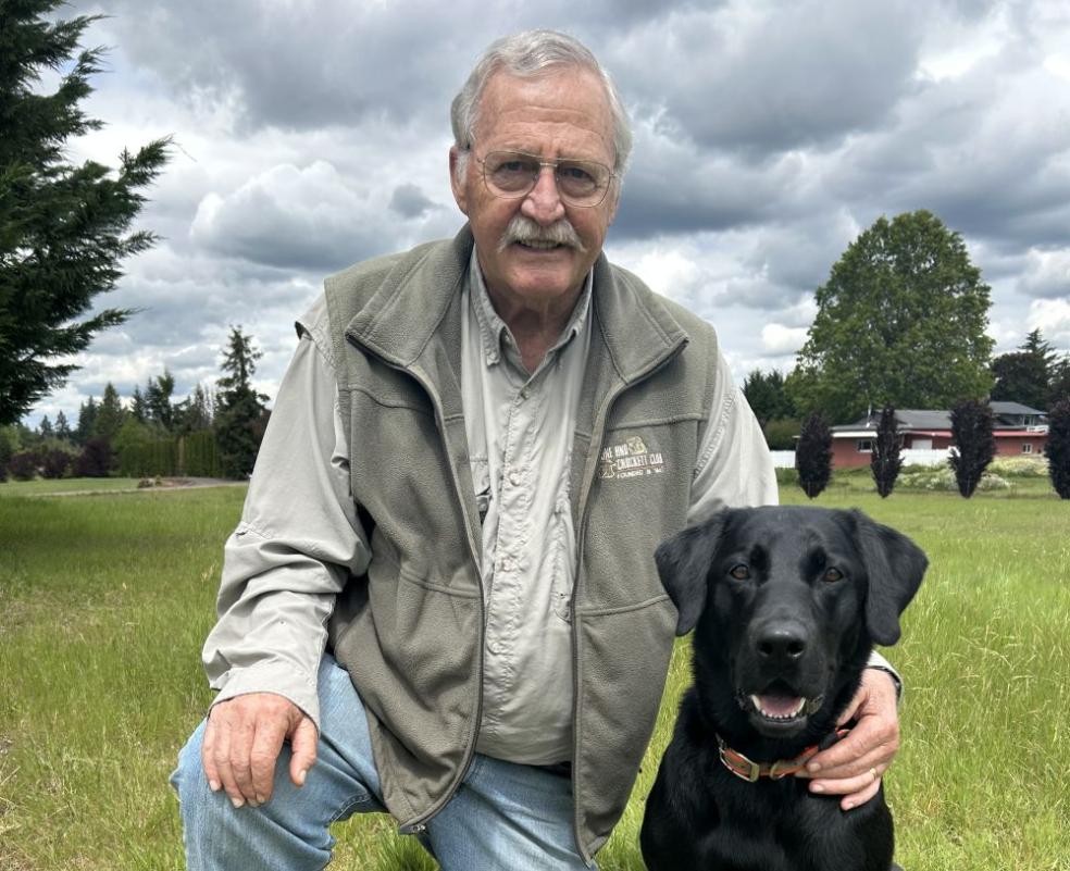 A photo of Terry Bowyers with his dog, Pippin,  taken in Estacada, Oregon.
