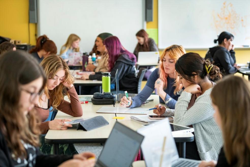 A photo of students studying in a classroom setting. 