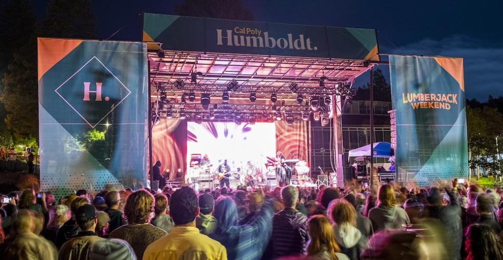 A photo of the stage and audience at Cal Poly Humboldt's Block Party. 