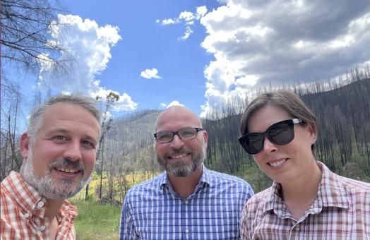 Jeff Kane, Benjamin Graham, and Erin Kelly in summer 2022 at the edge of the 2020 Slater Fire near Happy Camp, California.