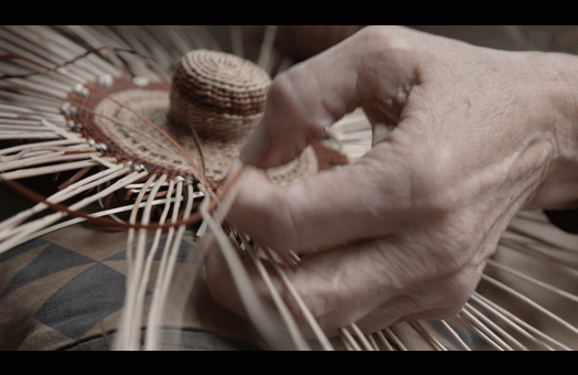 A film still showing basket weaving