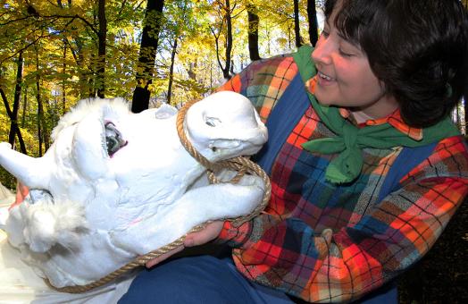 A photo of student Ash Quintana as Jack from Jack and the Beanstalk with Milky the cow from "Into the Woods"
