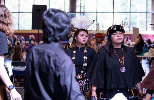 Shobe Britton (right), a double major in Child Development and Native American Studies and a member of the Covelo Round Valley Tribe at the 2023 Big Time.