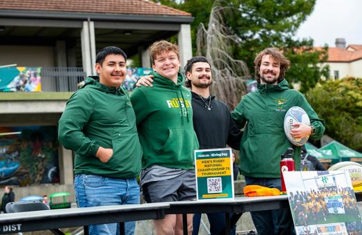 A group photo of Humboldt's Men's Rugby Team at the Giving Day fundraising fair. 