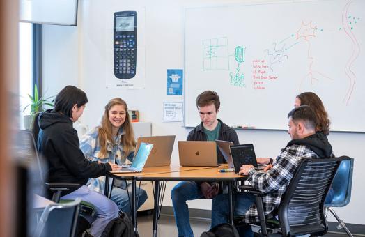 Students from departments throughout the College of Natural Resources & Sciences are collaborating to learn more about the brain’s immune system using mathematical modeling. “It is a really interdisciplinary project,” says Mathematics Professor Kamila Larripa. From left to right: Cheyenne Ty, Megan Pratt, John Gerving, Kamila Larripa, and Martin Mendoza-Ceja.