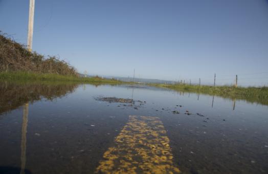 an off center photo of a flooded road