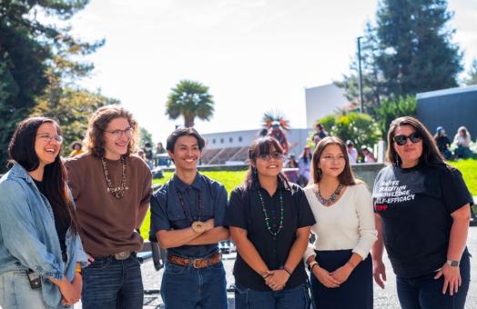 A photo of students and staff on the quad celebrating the kickoff of Indigenous People's Week. 
