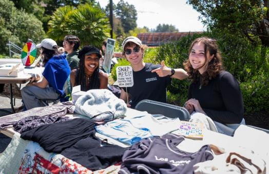A photo of students tabling on the quad for the Earth Week Swap Meet. 