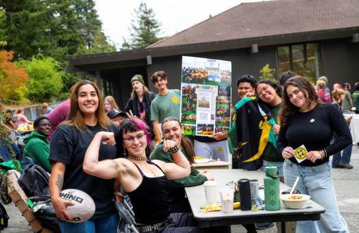 A photo of the Cal Poly Humboldt Women's Rugby team tabling during a club fair.