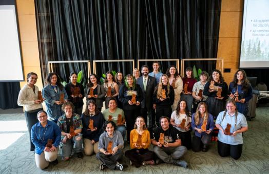 A group photo of all of the Outstanding Student Award winners with President Richard Carvajal. 