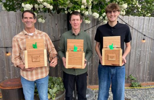A photo of 2026 Sustainability Champion Awards (left to right): Justus Ortega (on behalf of Jennifer Ortega), Christopher Dubois, and Riley McDaniel
