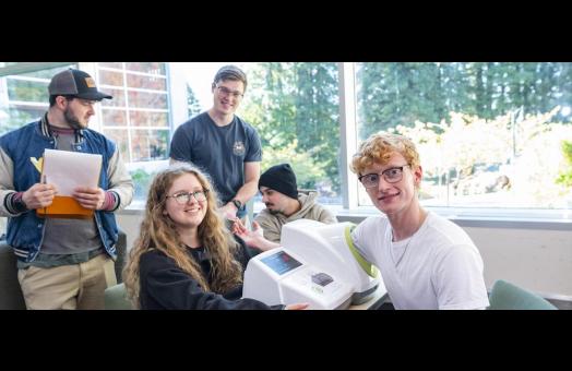 students taking a fellow student's blood pressure