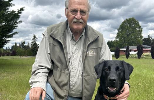 A photo of Terry Bowyers with his dog, Pippin,  taken in Estacada, Oregon.