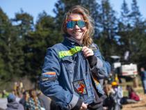 While there are usually few women who compete in logging sports, Cal Poly Humboldt’s team usually has more women than men competing, according to club members. Pictured: Elin Antaya showing off her battle jacket.