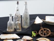 Glass bottles found at one of Falk’s cookhouses. Once used to serve condiments, they now serve as an important learning resource for students, who learn to date such items according to physical characteristics.