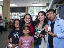 A photo of a student and family members checking in at Fall 2024 Move-In Day.