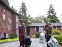 A photo of students moving into campus residence halls.