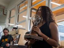 The Behavioral, Social Sciences &amp;amp; Public Administration trophy showcases a “Tree of Unity” with a globe at its center, symbolizing growth, collaboration, and the global impact of the fields.