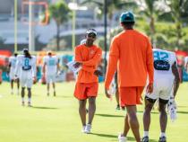 A photo of Robert Prince coaching Miami Dolphins wide receiver players during a training session.